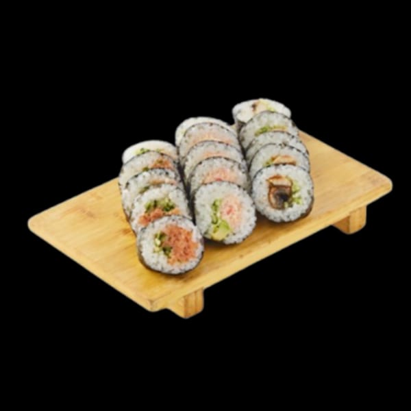 Assortment of sushi rolls with various fillings, including tuna and avocado, on a wooden serving board.