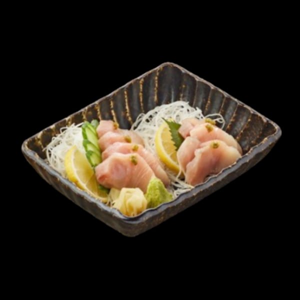 Platter of Totoyama Sushi & Ramen's albacore sashimi with lemon, cucumber, ginger, and wasabi.