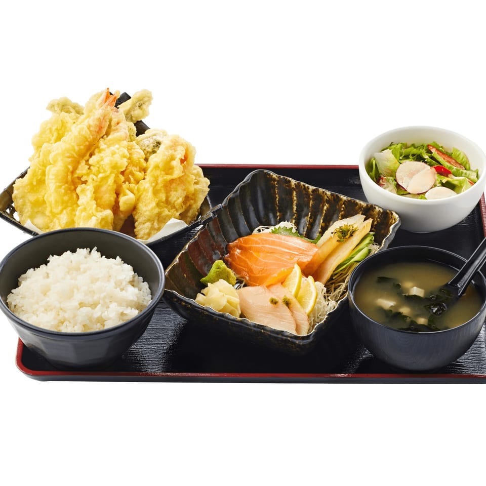 Totoyama Sushi & Ramen Hollywood's sashimi and tempura bento box with rice, salad, and miso soup.